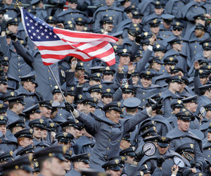 LANDOVER, MD - DECEMBER 10: An Army Cadet cheers during the first half against the Navy Midshipmen at FedEx Field on December 10, 2011 in Landover, Maryland.  (Photo by Rob Carr/Getty Images)