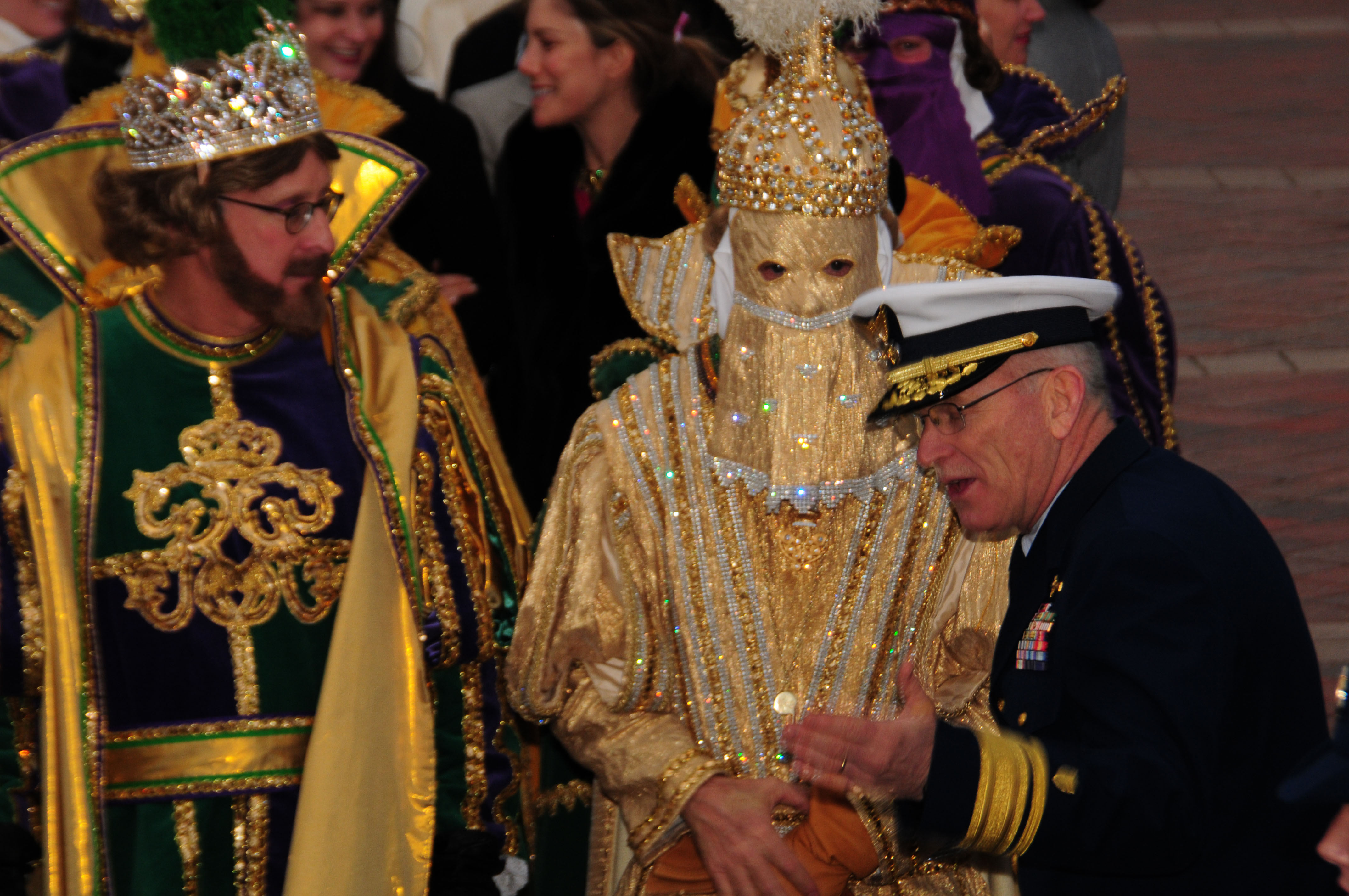 NEW ORLEANS - Rear Adm. Roy A. Nash (right), commander of the Eighth Coast Guard District, welcomes King Rex (left) and his krewe aboard the Coast Guard Cutter Harry Claiborne for their transport to Spanish Plaza in downtown, Feb. 20, 2012. The 175-foot coastal construction tender delivered the Mardi Gras monarchs Kings Rex and Zulu to kick off the official start of Lundi Gras 2012. U.S. Coast Guard photo by Petty Officer 2nd Class Bill Colclough. 